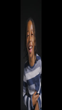 Vertical-Shot-of-a-Young-Boy-Laughing